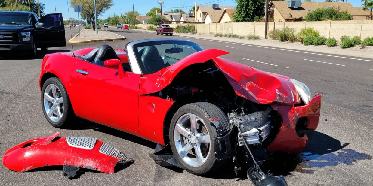 Collision-damaged vehicle at BZ Kustomz in Mesa, AZ